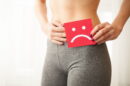 Vaginal urinary infection problems concept young woman holds paper with sad smile crotch 130x86