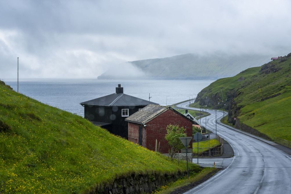 Empty street connecting two islands foggy sky