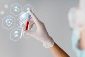 Baner medyczny z lekarzem trzymajacym fiolke 300x200