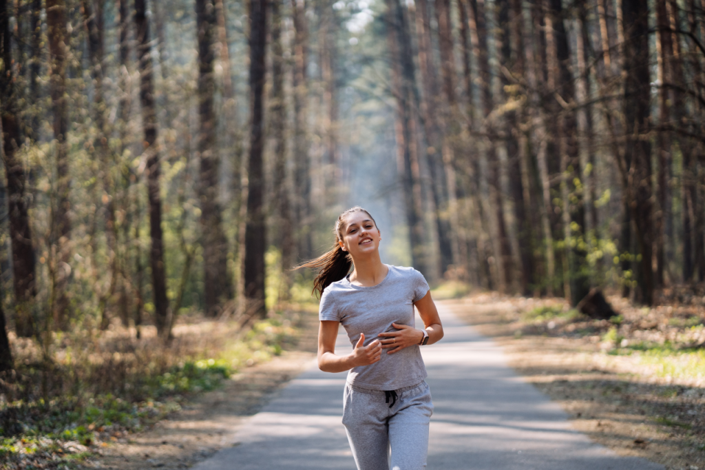 Beautiful young woman running green park sunny summer day 1024x682