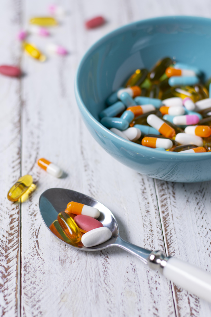 High angle bowl spoon with pills 682x1024
