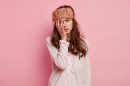 Young woman wearing pajamas sleep mask 130x86
