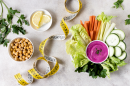 Flat lay vegetables with chickpeas measuring tape 130x86