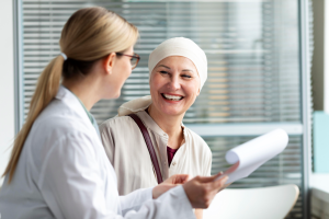 Middle aged woman with skin cancer talking with her doctor 300x200