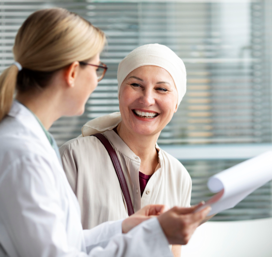 Middle aged woman with skin cancer talking with her doctor 550x520