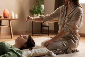 Person conducting reiki therapy 300x200