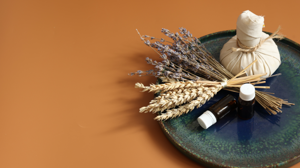 Spa composition with herbal bag natural oils jars dried flowers 990x556