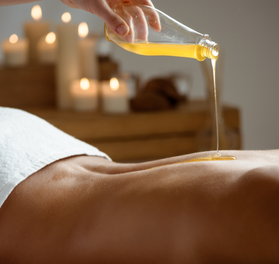 Honey pouring woman s naked back spa salon 550x520