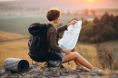 Woman travelling using map 130x86