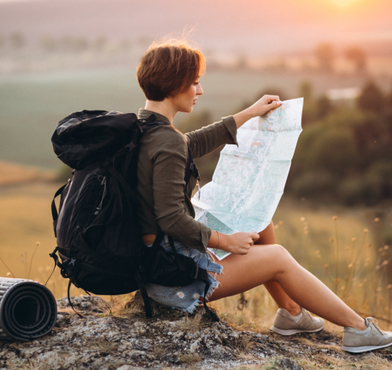 Woman travelling using map 550x520