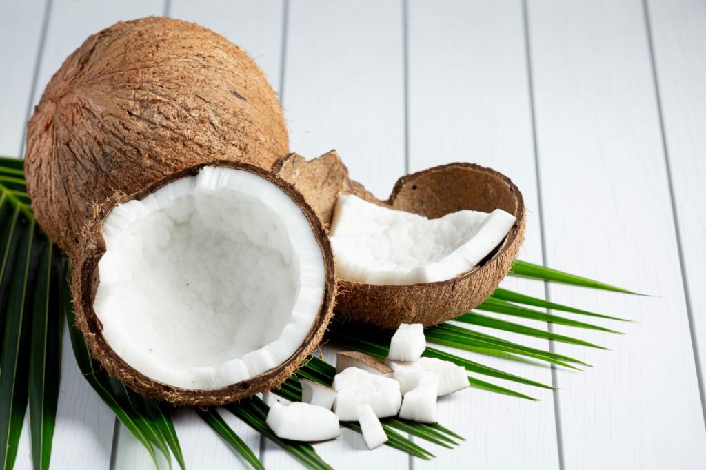 Fresh coconuts put white wooden background 1024x682