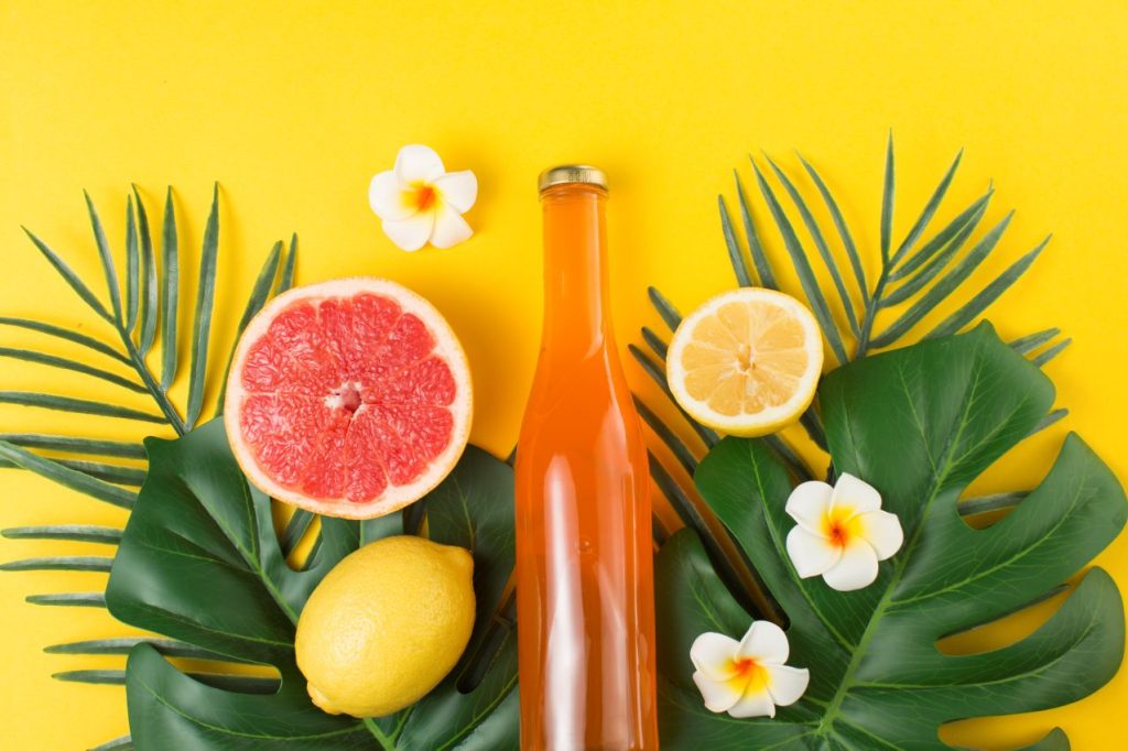 Green tropical plant leaves bottle drink 1 1024x682