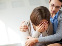 Sad woman crying her therapist 215x161