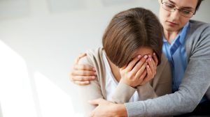 Sad woman crying her therapist 300x168