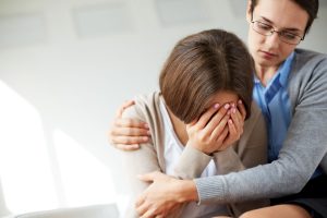 Sad woman crying her therapist 300x200