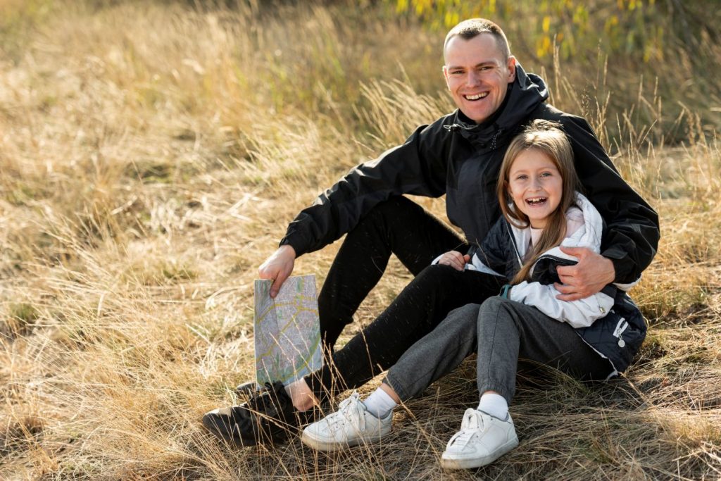 Smiling daughter father looking photographer 1024x683