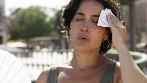 Elder woman struggling with high temperature 470x264