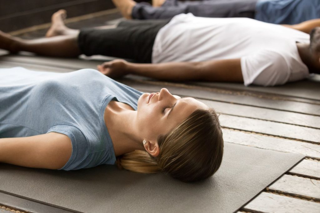 Group sporty people dead body exercise 1024x682