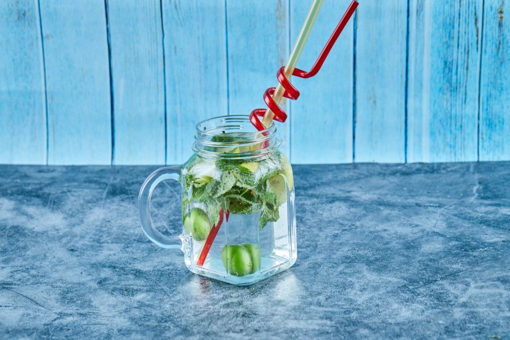 Mojito cocktail with slices lime mint blue table 1024x682