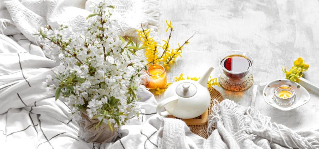 Spring still life with cup tea flowers 1024x477