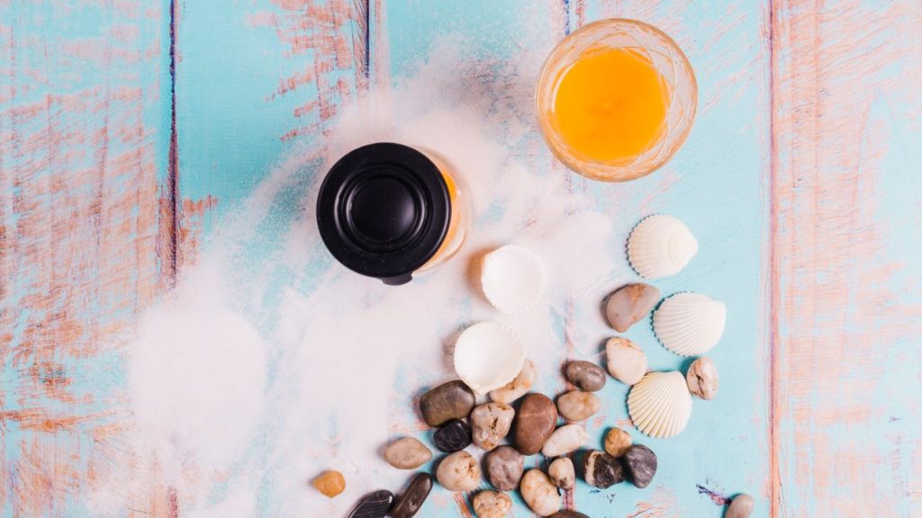 Beach concept with juice jar sea sand 1024x576