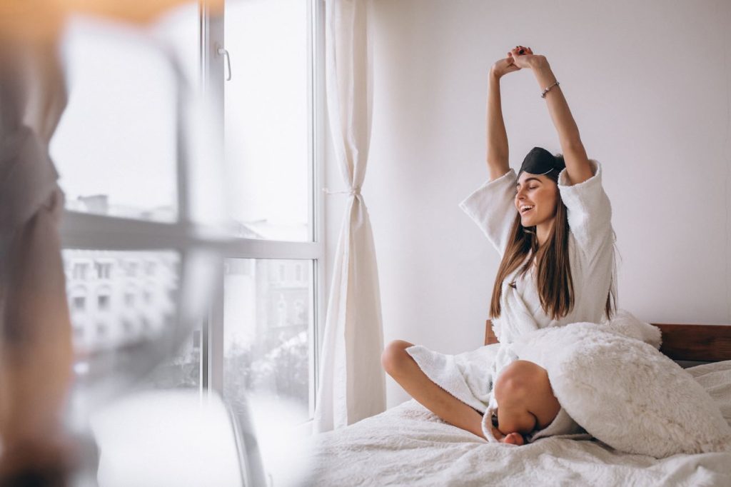 Woman bed wearing sleeping mask 1024x682