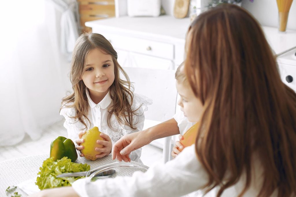 Family preparing salad kitchen 1024x682