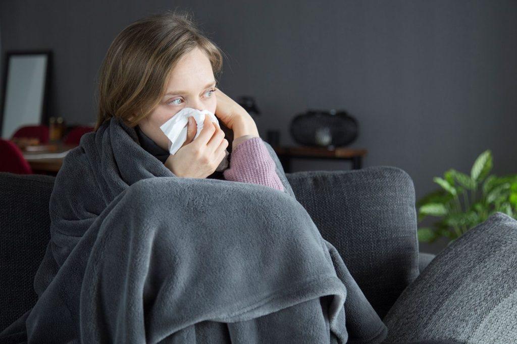 Bored sick woman holding hand head blowing nose with napkin 1024x682