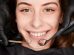 Cheerful young woman having dental examination clinic 74x55