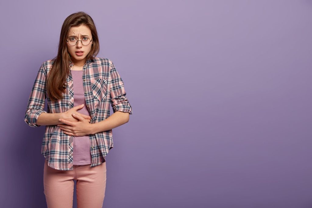 Young brunette woman colorful clothes 1024x682
